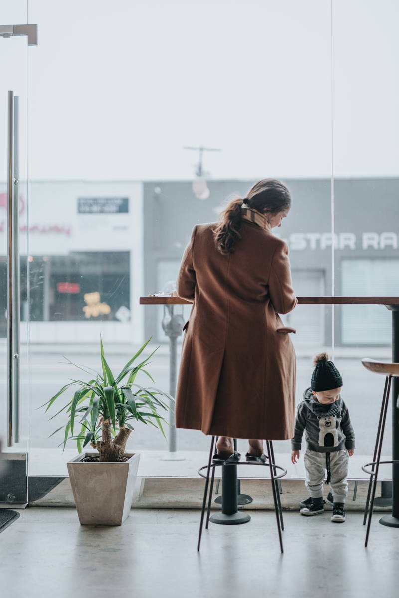 Working mom with her child at a coffee shop