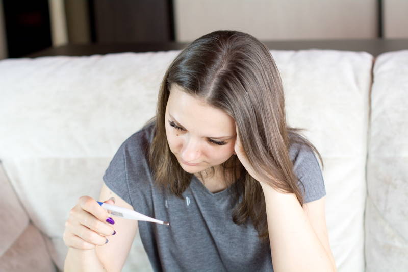 Woman home sick from work