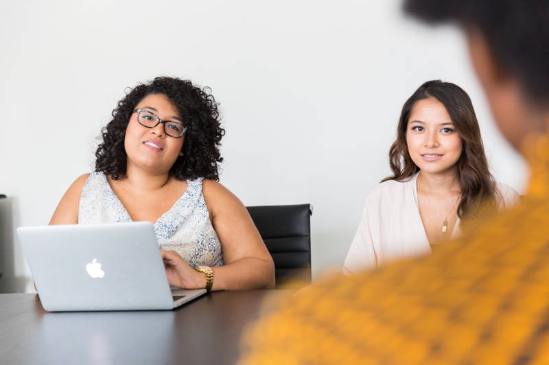 Two women interviewing a job candidate