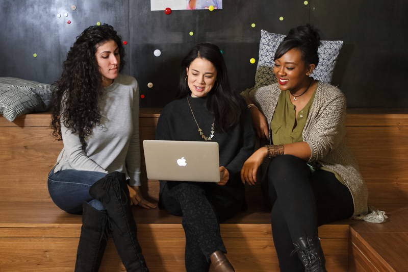 Three women influencing company culture at work