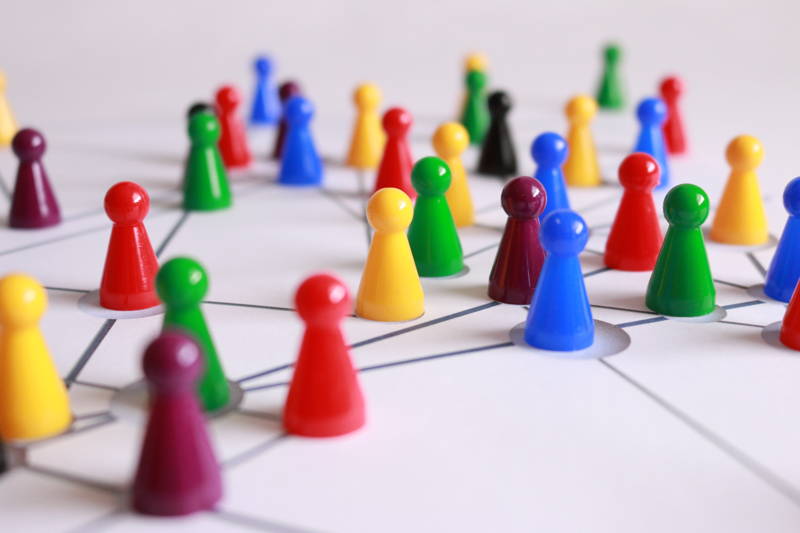 Closeup of board game to represent the strategy of negotiating job benefits