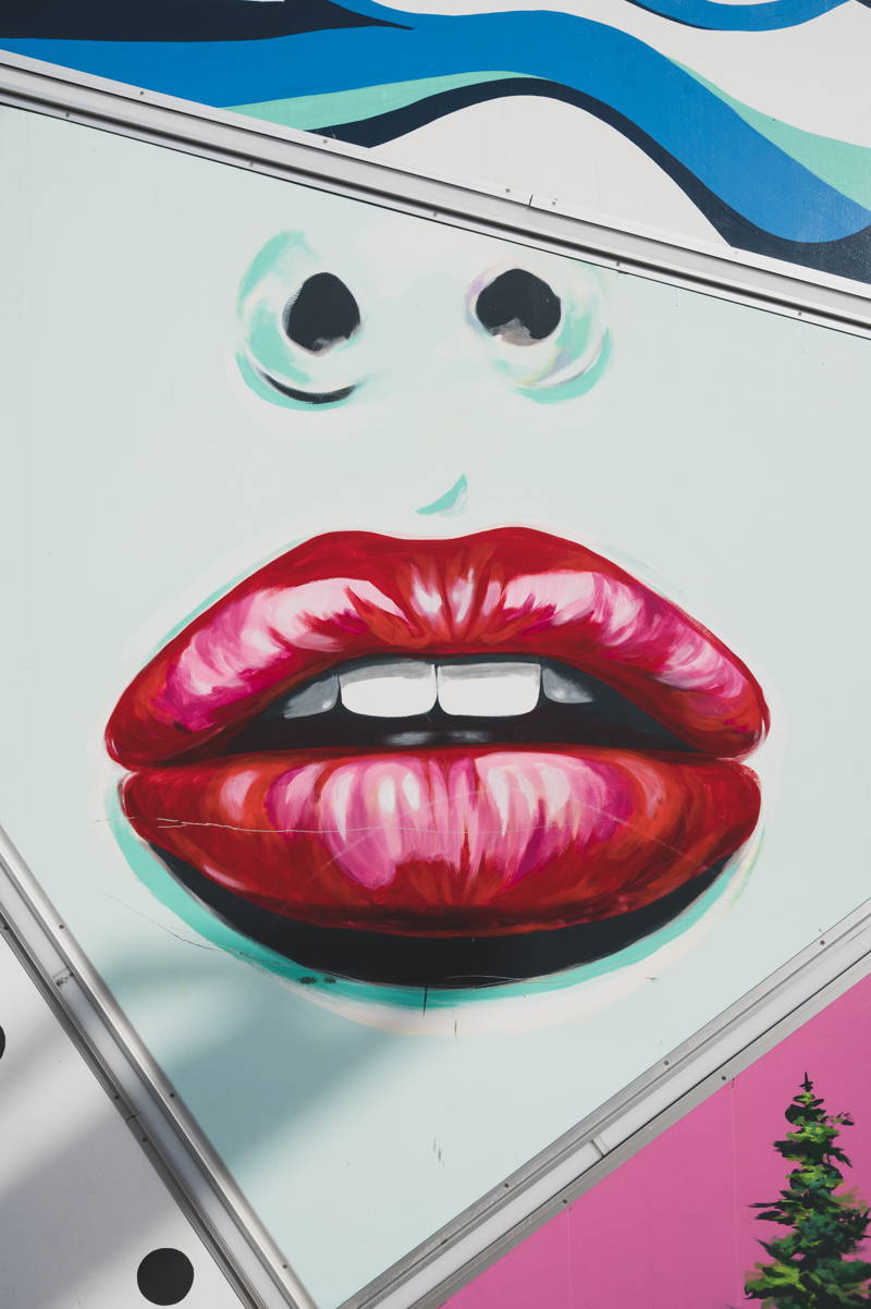 Painting of a woman's lips on a wall