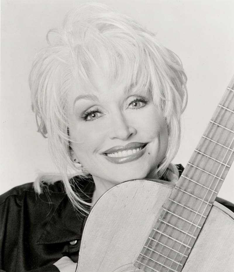 Dolly Parton with a guitar