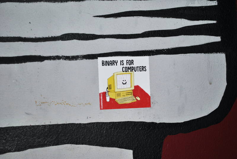 Sticker that says "binary is for computers"