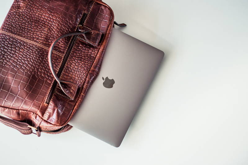Apple product falling out of designer purse
