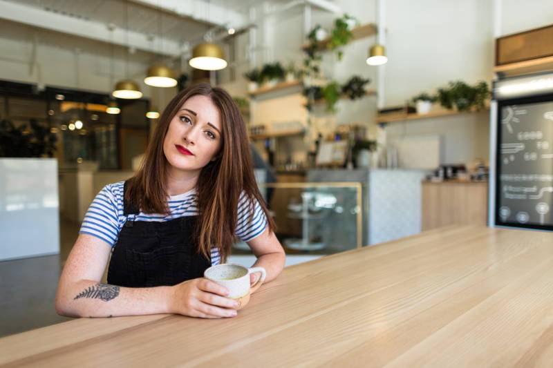 Woman working at a coffee shop annoyed after giving her two weeks notice