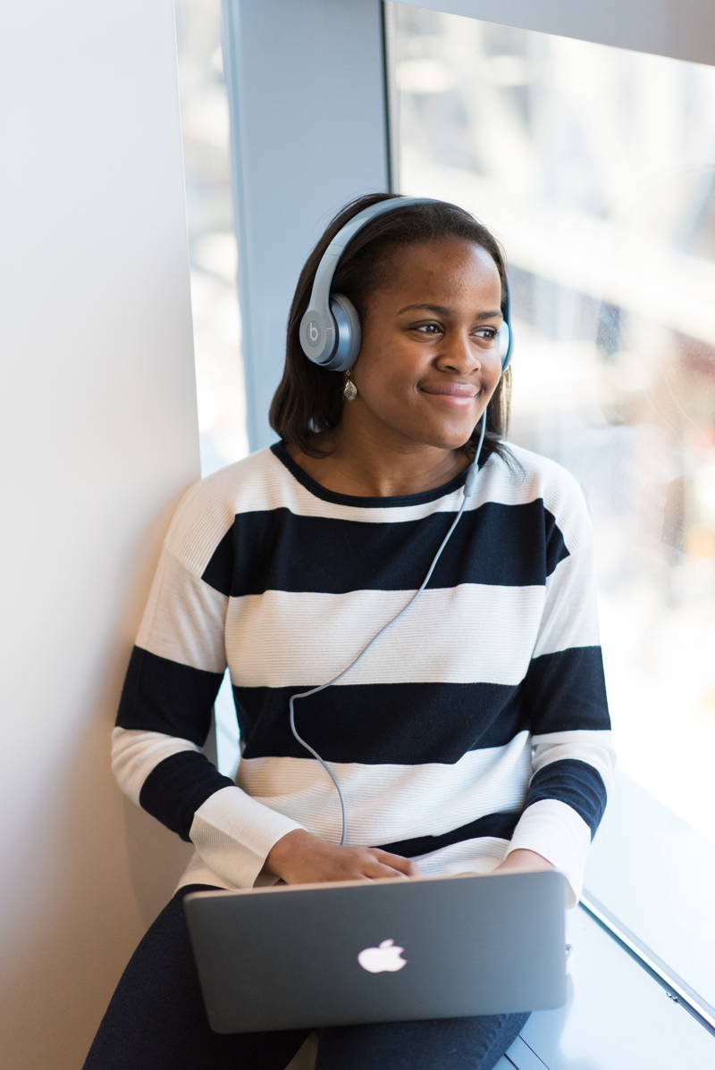 Woman listening to ambient noise on her headphones