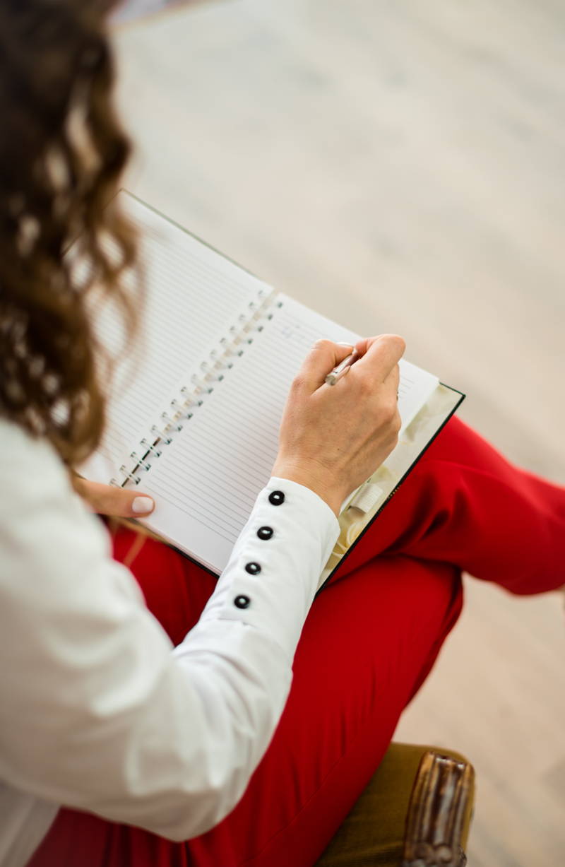 woman writing a professional development plan