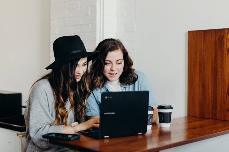 Two women on a laptop