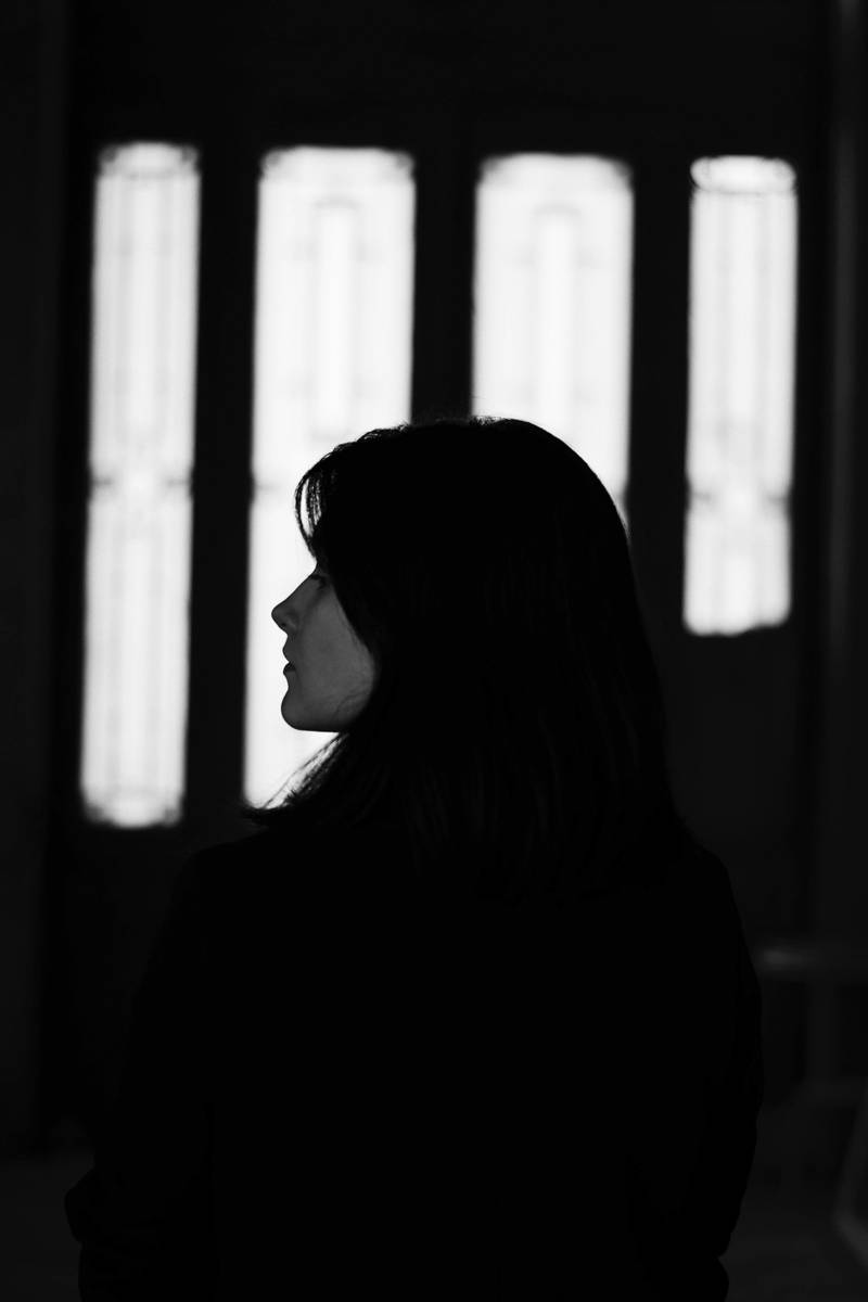 side profile of woman experiencing grief in the workplace