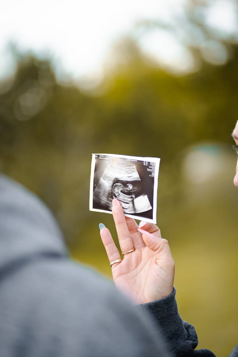 Woman holding her ultrasound image